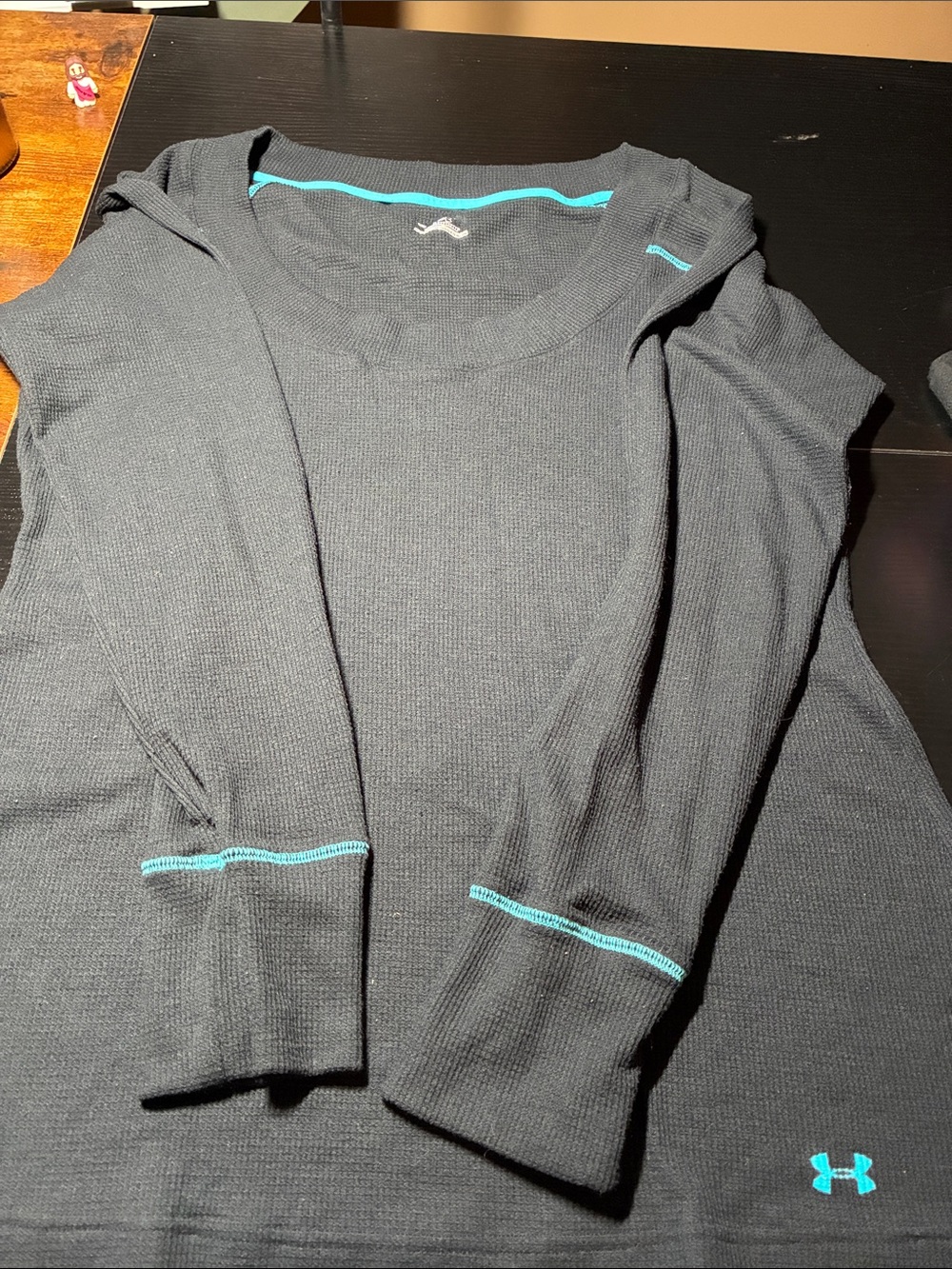 Under Armour Ladies Black Crewneck Cold gear top with Teal Trim